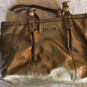 Gold Coach patent leather purse.